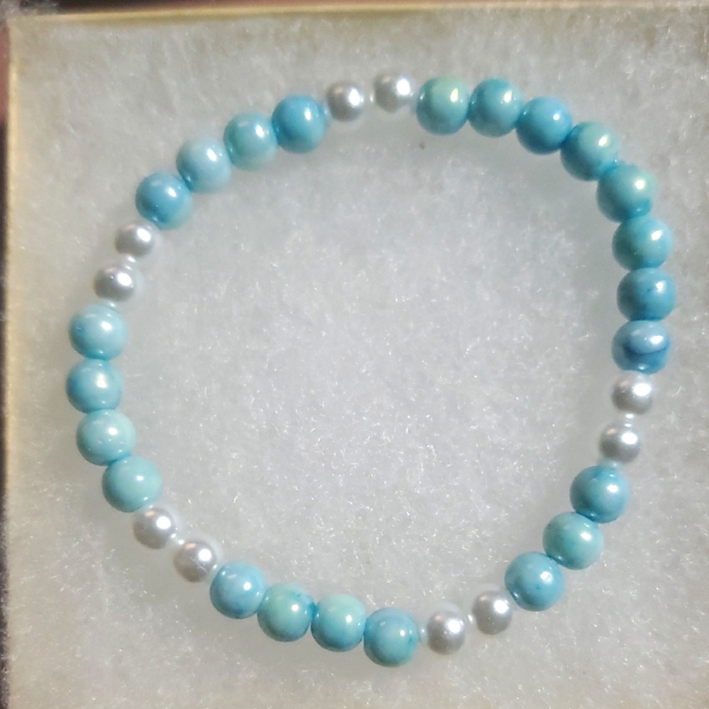 Handmade by my daughter.Elegant Blue and Pearl White Beaded Bracelet